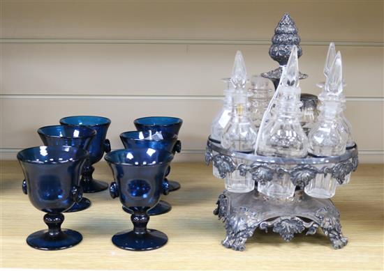 A plated seven-bottle cruet set (some bottles a.f) and a set of six blue glass goblets